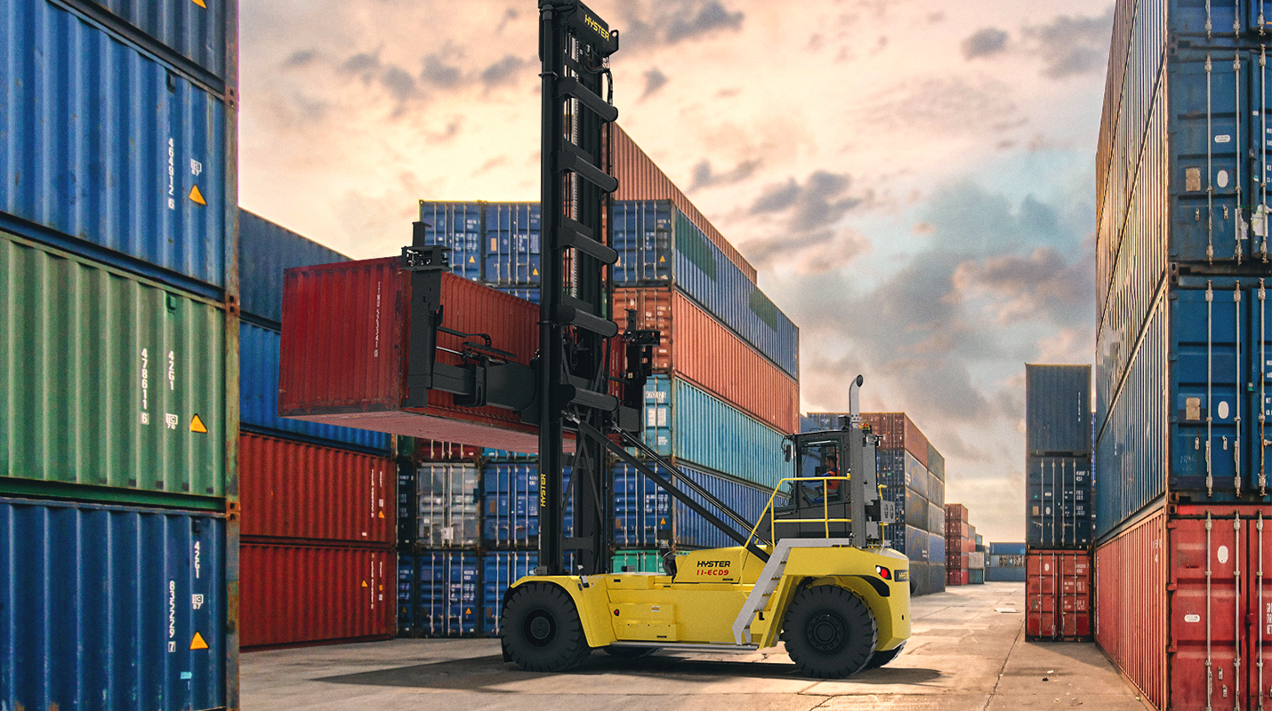Hyster container handler at a shipyard or port moving a container. 