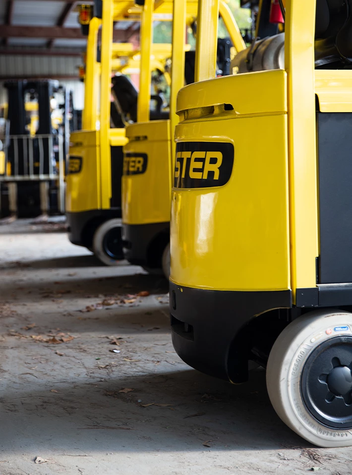Multiple Hyster pneumatic tire forklifts. 