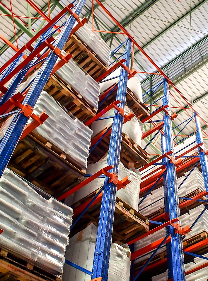 Tall warehouse racking with loads on shelves.