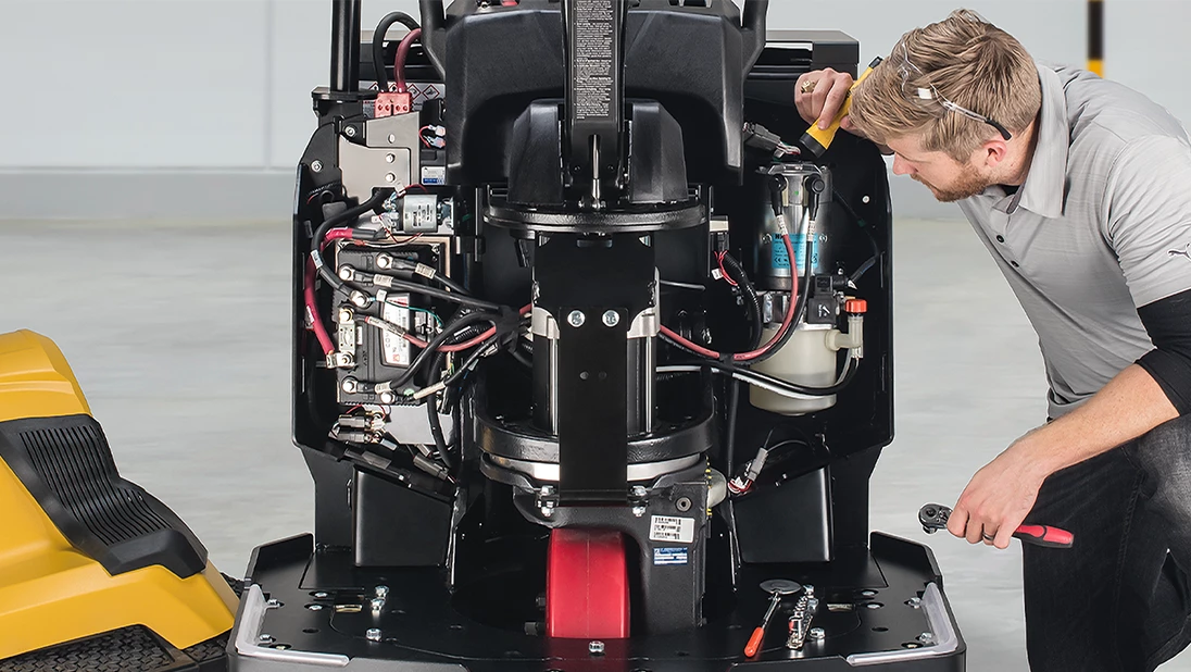 Service technician looking at Yale end rider electrical system.